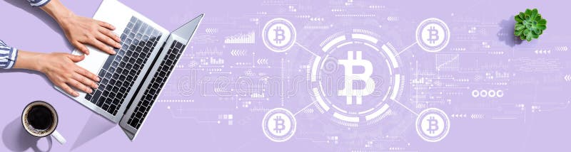 Bitcoin theme with person using a laptop stock photography