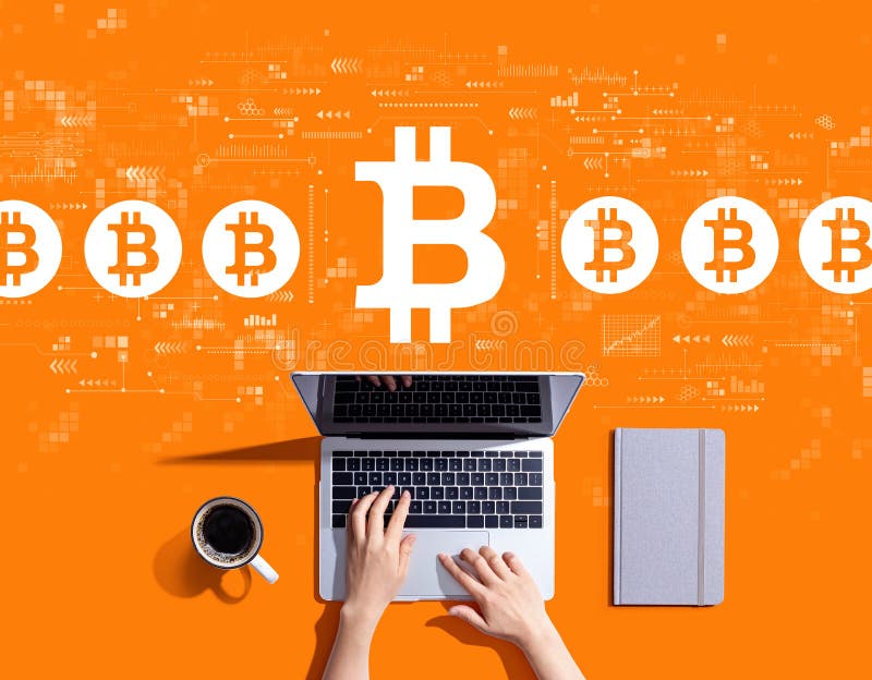 Bitcoin theme with person using a laptop stock images