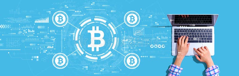 Bitcoin theme with person using a laptop stock image