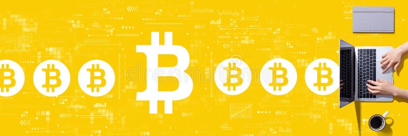 Bitcoin theme with person using a laptop stock image