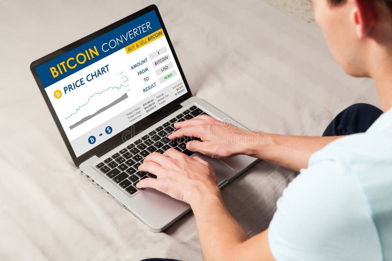 Bitcoin trading website. Man using a laptop to trade bitcoin price by internet. stock photos Bitcoin trading website. Man using a laptop to trade bitcoin price by internet. stock photos