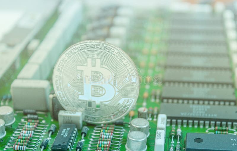 Bitcoin на плате с печатным монтажом стоковое фото Bitcoin на плате с печатным монтажом стоковое фото