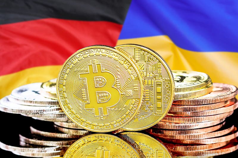 Bitcoins en fondo de la bandera de Ucrania y de Alemania imagen de archivo Bitcoins en fondo de la bandera de Ucrania y de Alemania imagen de archivo