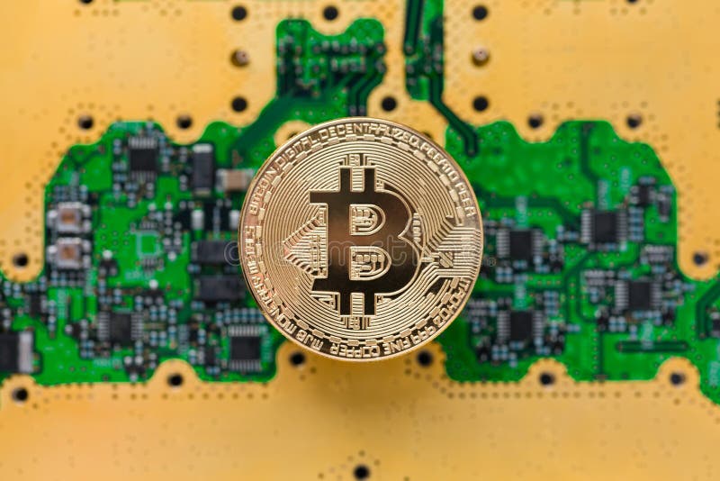 Bitcoins on the microchip background. Physical bit coins. Digital currency. Cryptocurrency royalty free stock photography