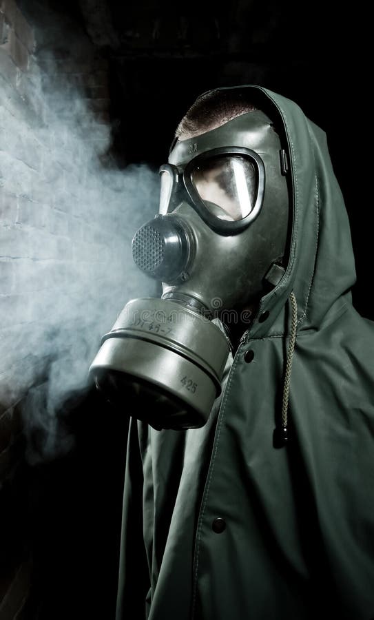 Bizarre portrait of man in gas mask