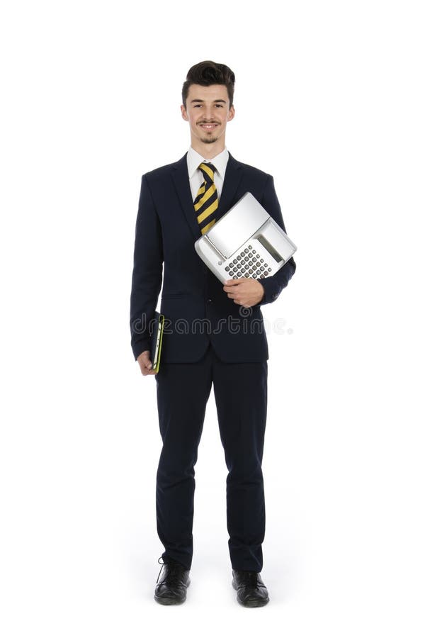 Biznesmen pozycja w studiu z komputerem i kasą ja zdjęcia royalty free Biznesmen pozycja w studiu z komputerem i kasą ja zdjęcia royalty free