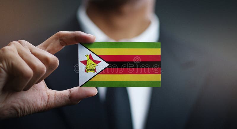 Biznesmena mienia karta Zimbabwe flaga obrazy royalty free