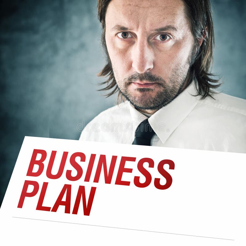 Biznesmena mienia plakat z plan biznesowy drukującym tytułem zdjęcie royalty free Biznesmena mienia plakat z plan biznesowy drukującym tytułem zdjęcie royalty free