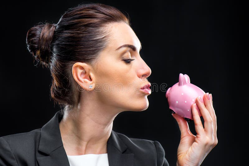 Bizneswoman Trzyma Piggybank zdjęcia stock Bizneswoman Trzyma Piggybank zdjęcia stock