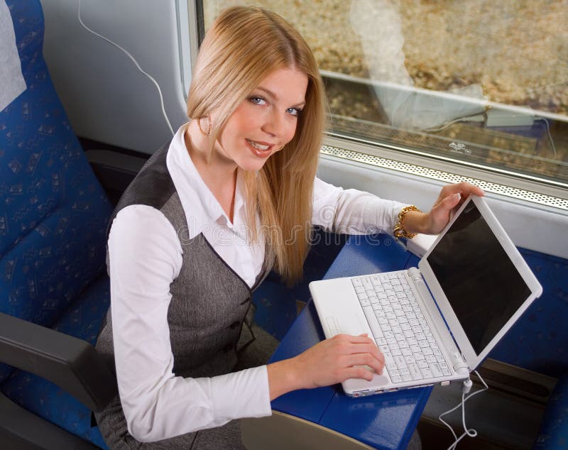 Businesswoman with laptop working in train. Businesswoman with laptop working in train