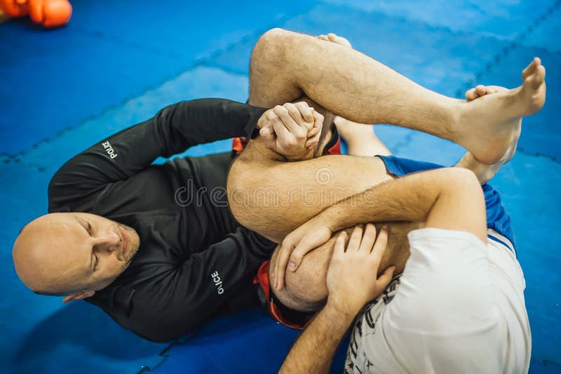 BJJ Brazilian jiu-jitsu ground fight. Leg lock calf slicer submission