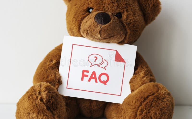 Björndocka med ett FAQ-kort royaltyfri bild Björndocka med ett FAQ-kort royaltyfri bild