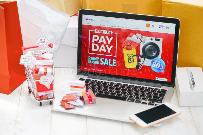 Shopping online concept focus on the screen of Lazada Pay day. Shopping cart`s bubble wrote ADD TO CART. stock photography Shopping online concept focus on the screen of Lazada Pay day. Shopping cart`s bubble wrote ADD TO CART. stock photography