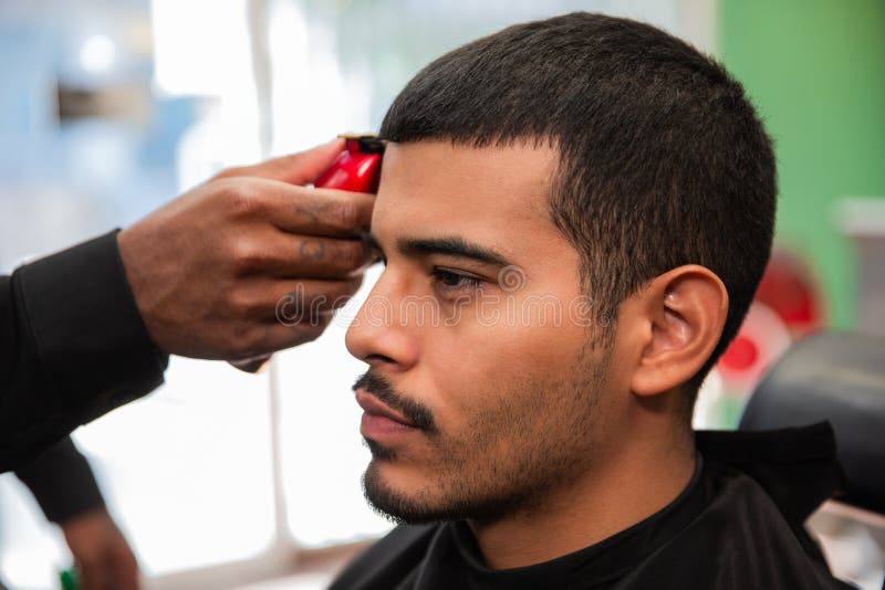African-American Barber`s Hand Uses Razor and Haircut on Hispanic Latino  Man with Goatee in a Barbershop Stock Image - Image of hair, american:  199646433