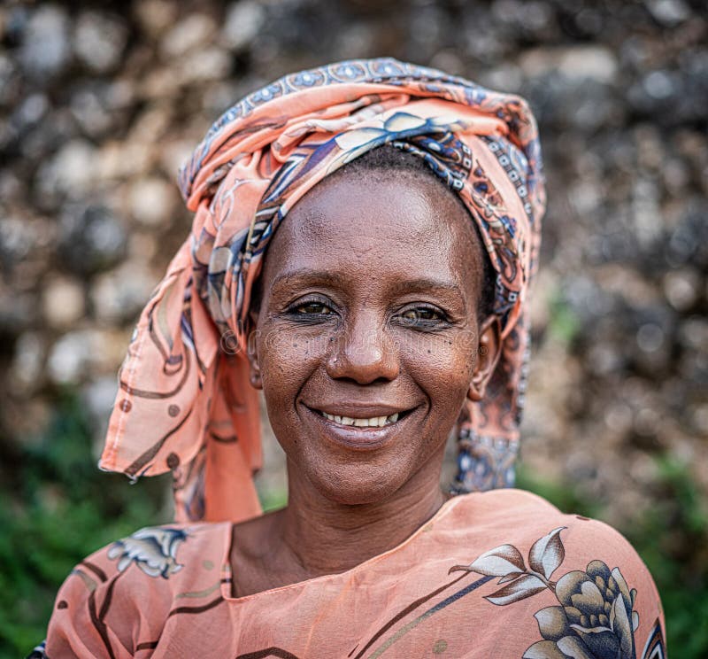 Black African senior beautiful woman with scarf outdoors portrait