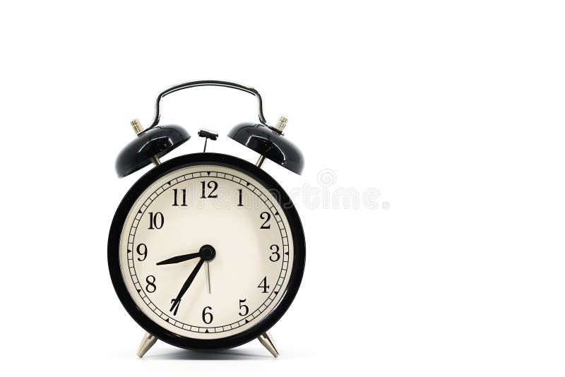 A black alarm clock with two bells on top, chrome handle, and legs, set against a white background. Timeless design meets royalty free stock image