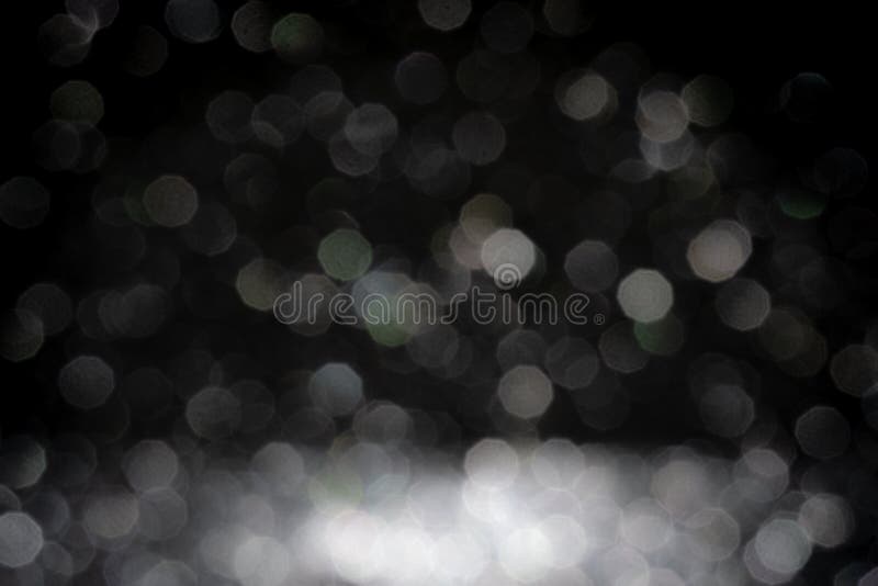 Black background for christmas navy glitter sparkle. Abstract bokeh light shiny dark holiday.