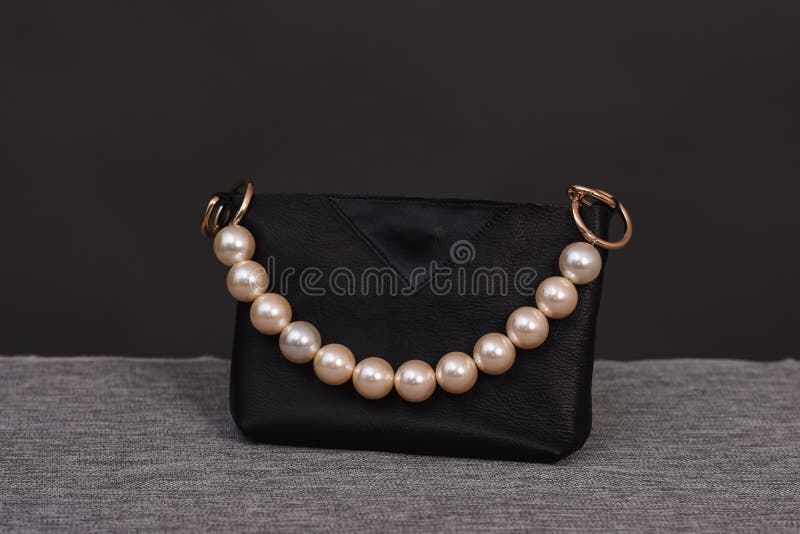 Black Bag with Pearl Handles on a Gray Background Stock Photo - Image ...