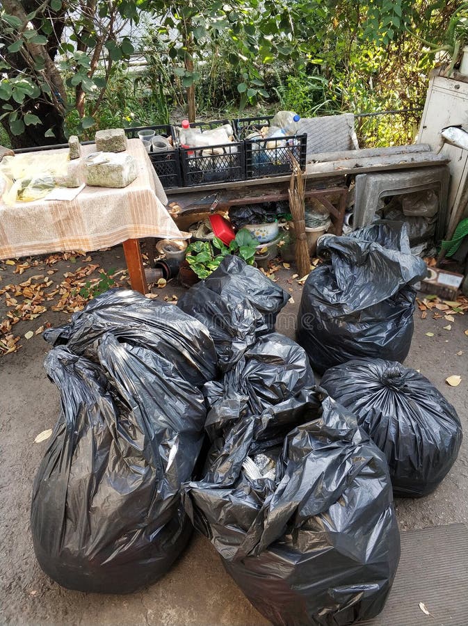 Premium Photo  Heap of plastic trash bags on curb waiting for