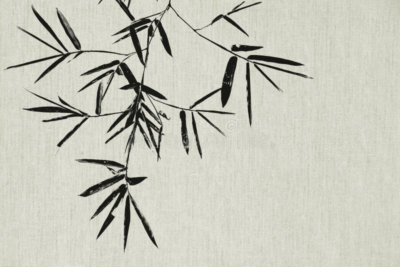 Black bamboo leaf and branch on fabric texture background