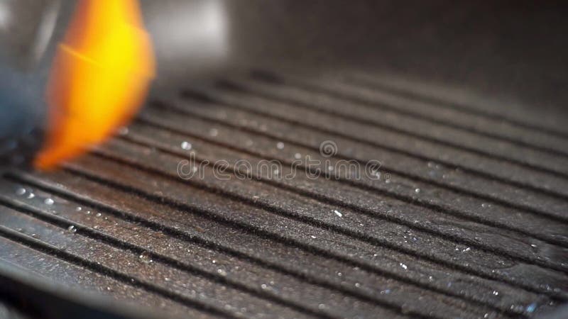 On the black Barbecue Grill, use a soft brush to smear the oil before cooking street food