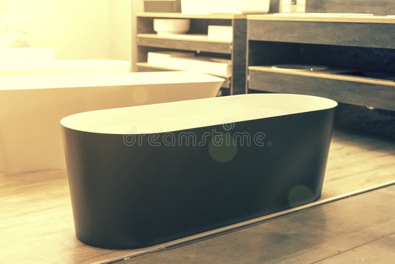 Black Bathtub at a Hardware Store. Sanitary Engineering Shop Stock