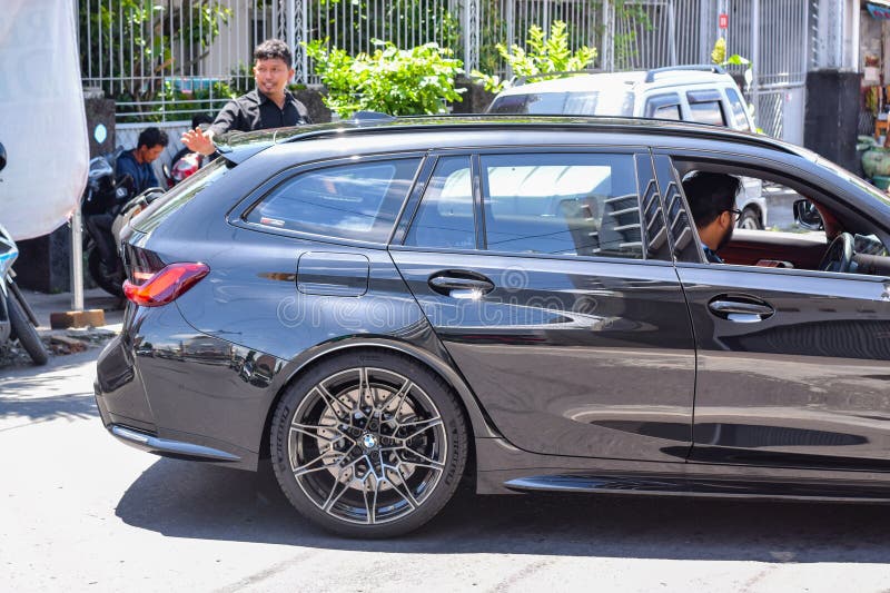 Surakarta Indonesia February 9 2024 BMW M3 G81 is the sixth generation of BMW M3. It available in four doors sedan and station wagon bodystyle. The engine is S58 six cylinders twin turbo that able to produced 510 horsepower and paired with all wheel drive. Surakarta Indonesia February 9 2024 BMW M3 G81 is the sixth generation of BMW M3. It available in four doors sedan and station wagon bodystyle. The engine is S58 six cylinders twin turbo that able to produced 510 horsepower and paired with all wheel drive