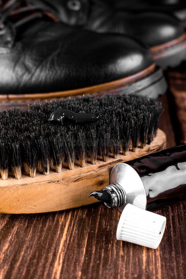 polishing black boots