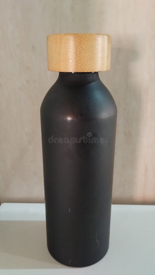 Black bottle on the table, representing sports and health royalty free stock photos