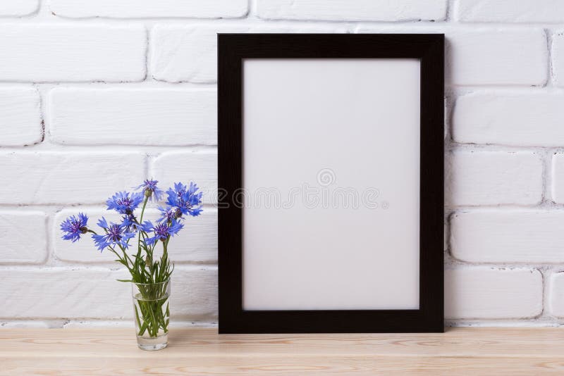 Black brown poster frame mockup with cornflower stock photography Black brown poster frame mockup with cornflower stock photography