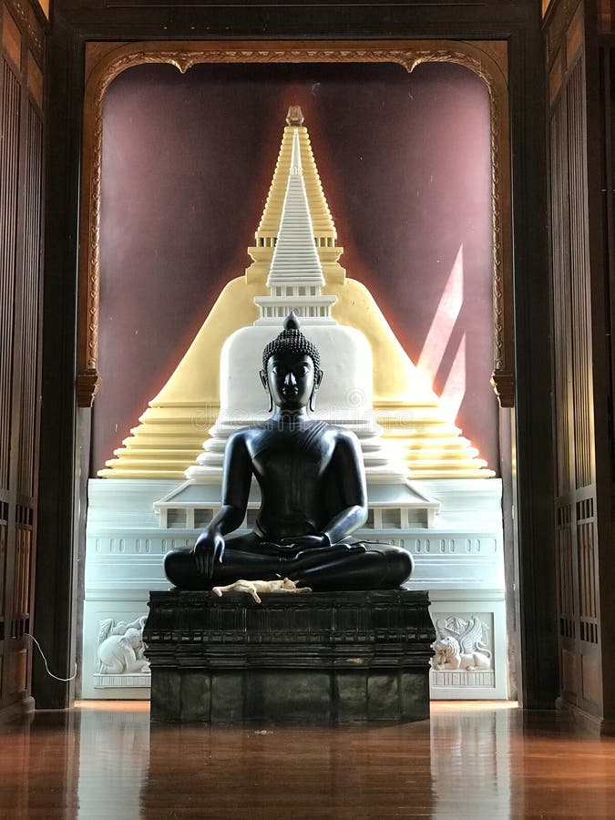 The Black Buddha Statue on the High Base is Located in the Room. Stock Image Image of room