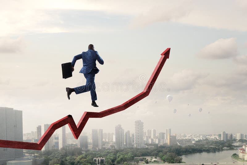 Black businessman running on red increasing arrow royalty free stock photo