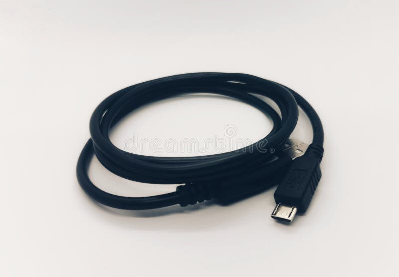 Black cable USB Type-C charging and data transfer cable with USB-A connector, isolated on a clean white background, suitable for modern electronic devices. Usb data transfer stock images, royalty-free photos and pictures