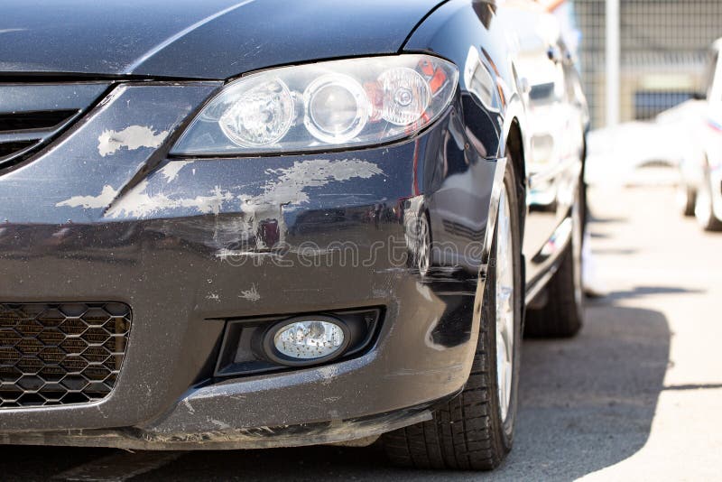 Scratched Car Bumper with Deep Damage To the Paint, Damaged by Accident