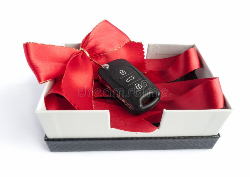 Black car key in a present box