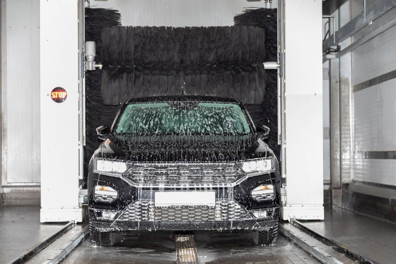 Black Car Stands in a Car Wash and is Washed Stock Image Image of