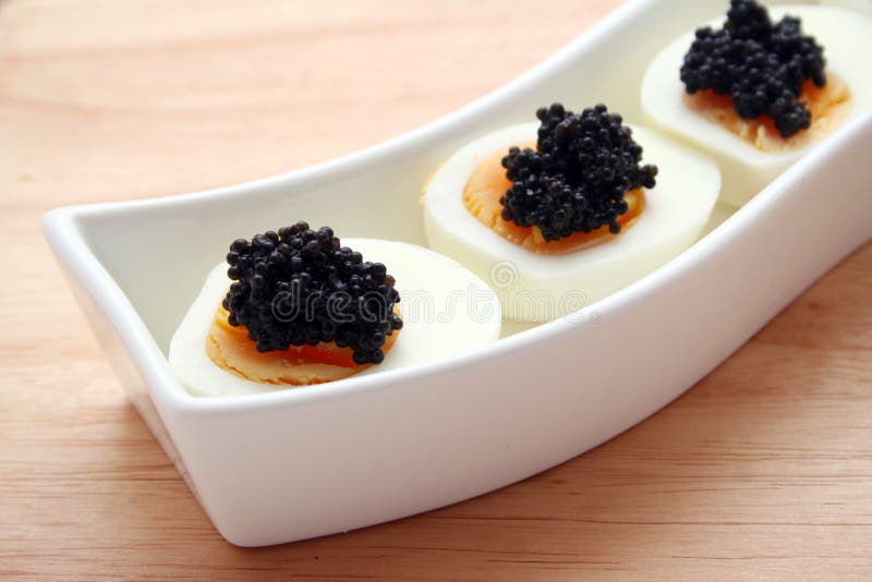 Black Caviar On Eggs Stock Photography Image 4201432