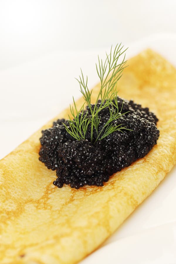 Black caviar in pancake