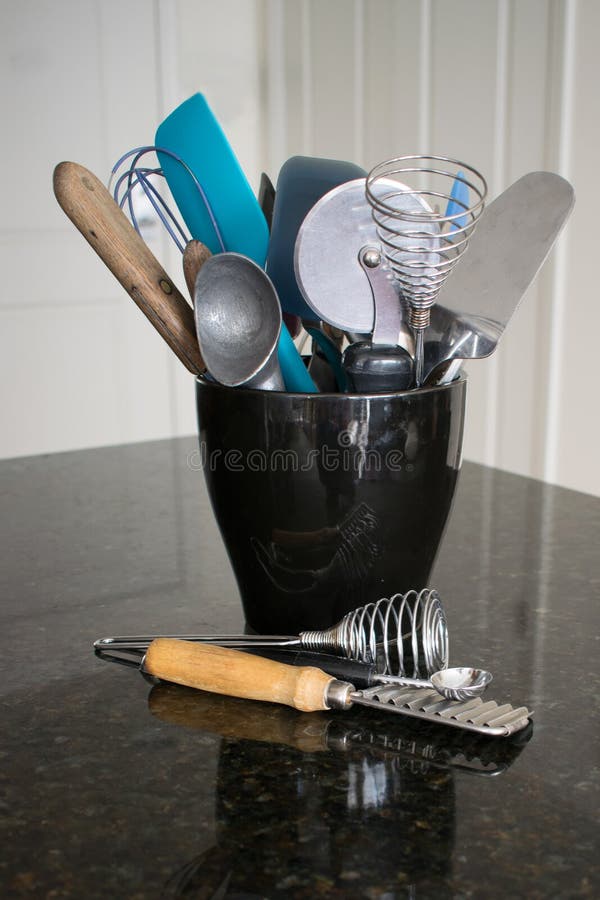 Black Ceramic Container Filled with Kitchen Utensils Stock Photo