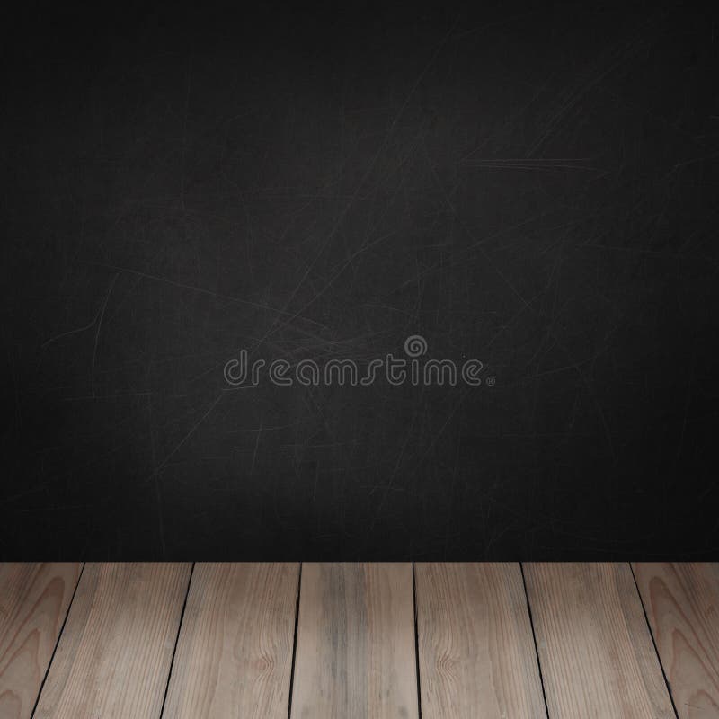 Black chalkboard wall and wooden board floor background for advertising marketing and product placement.