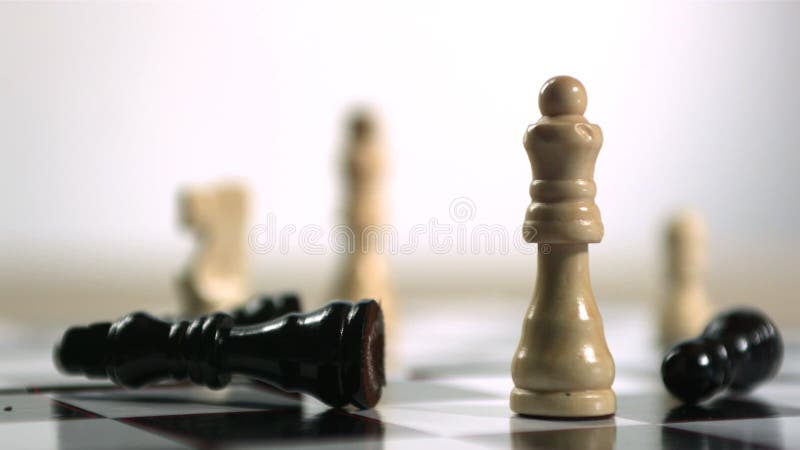 Black chess piece falling over, Stock Video