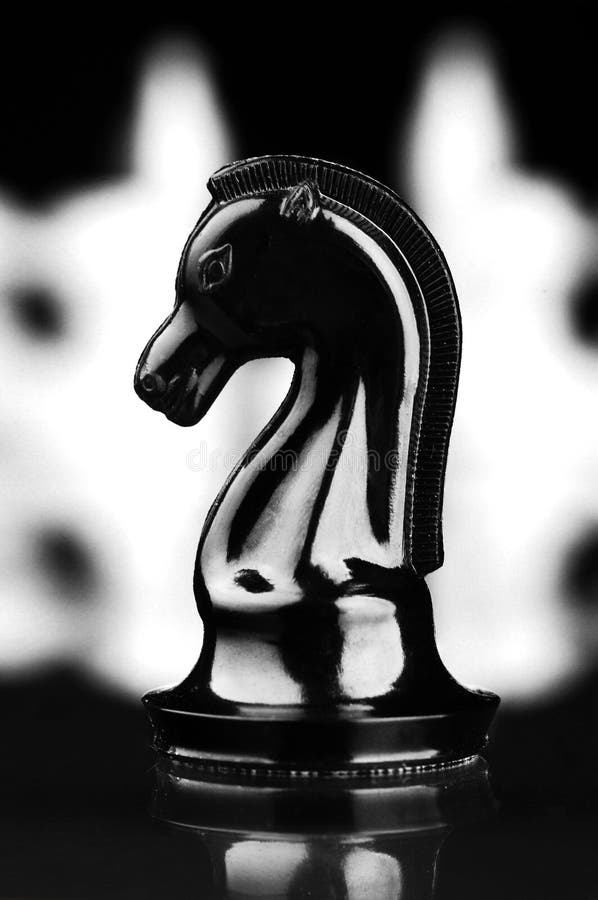 White Knight Amongst Black Chess Pieces Stock Image - Image of ...