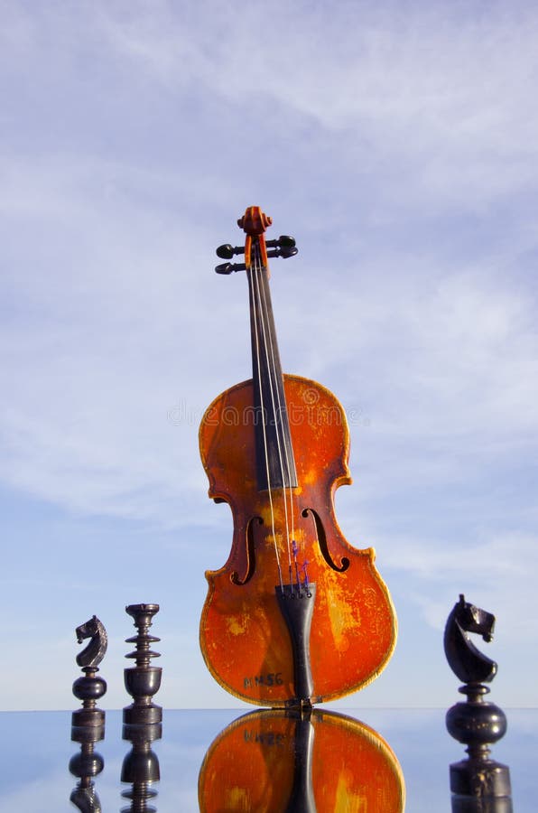 Black chess and vintage violin