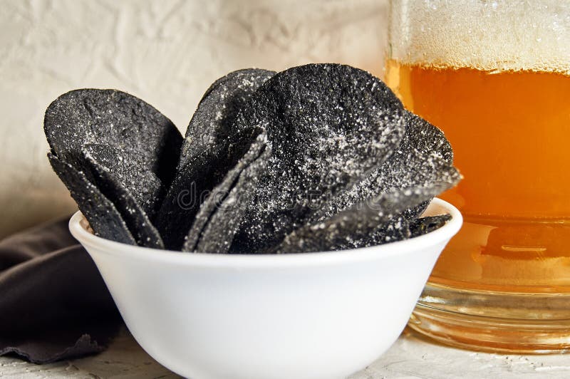 Black Chips and Beer. Alcoholic Drink and Snacks. Original Beer Snack