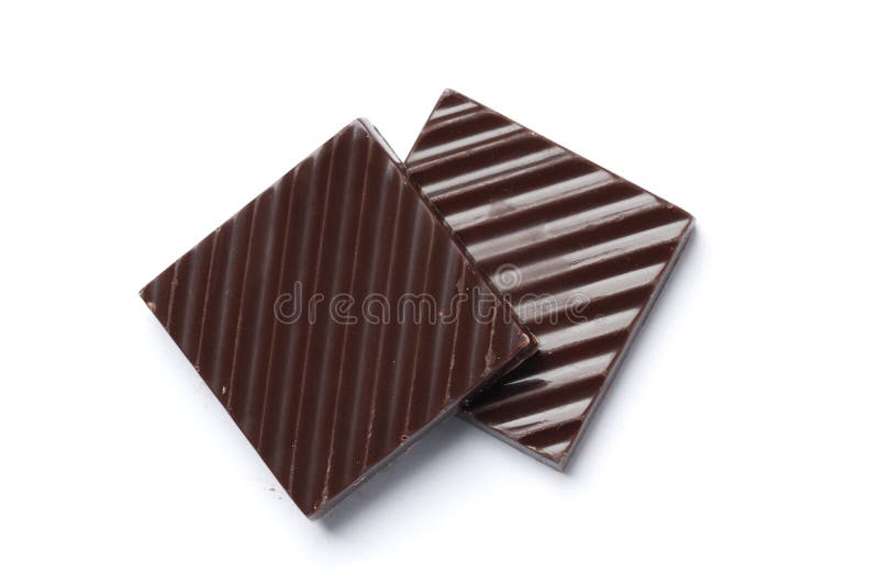 Black chocolate pieces isolated on a white background delicious desser