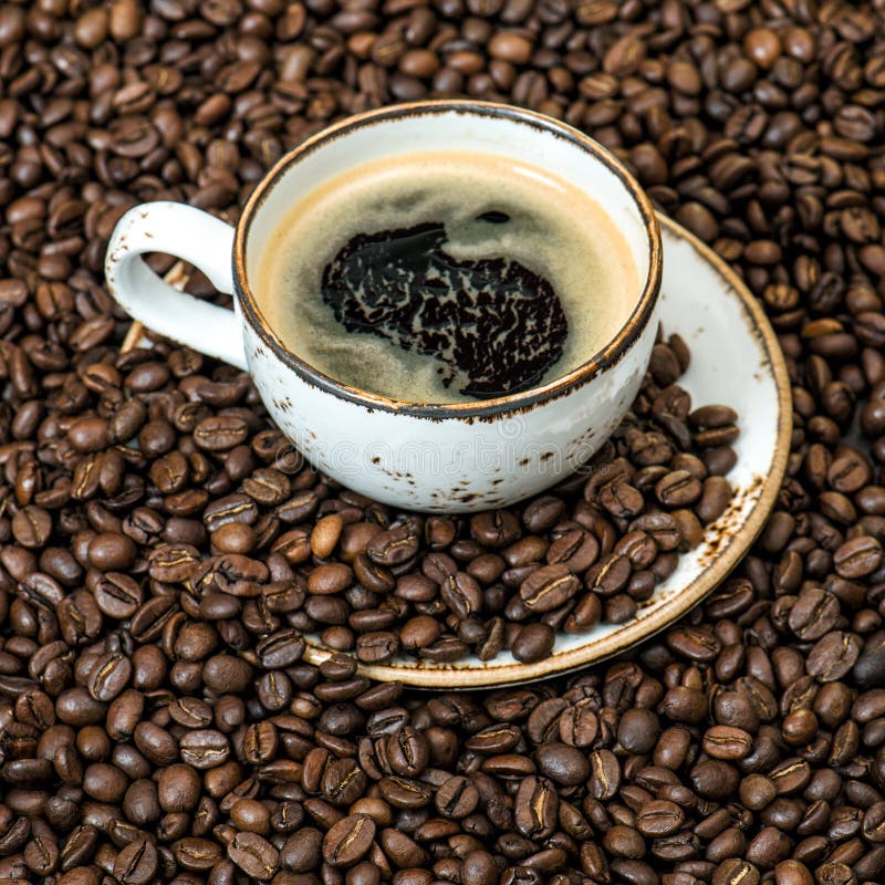 Black coffee beans background. Food drink