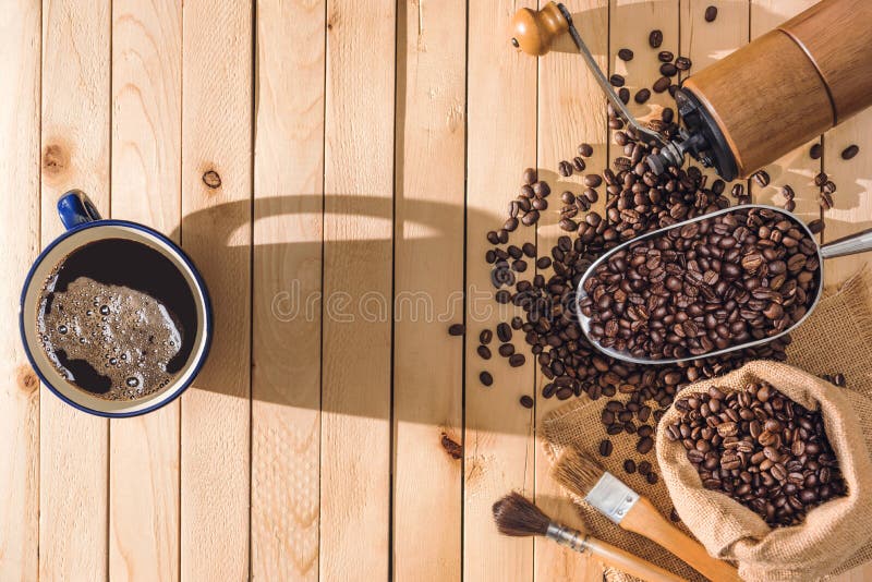 Black Coffee and Coffee Beans on the Table Wooden Background and