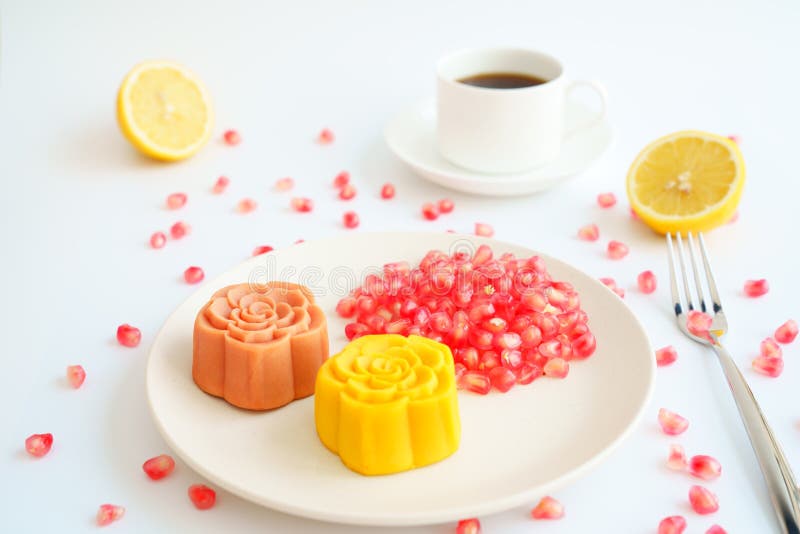 Colorful Chinese moon cakes and coffee with white background