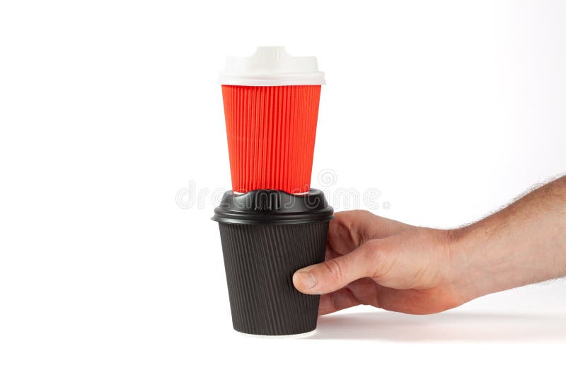 Black coffee cup with red coffee cup on top. stock photo Black coffee cup with red coffee cup on top. stock photo