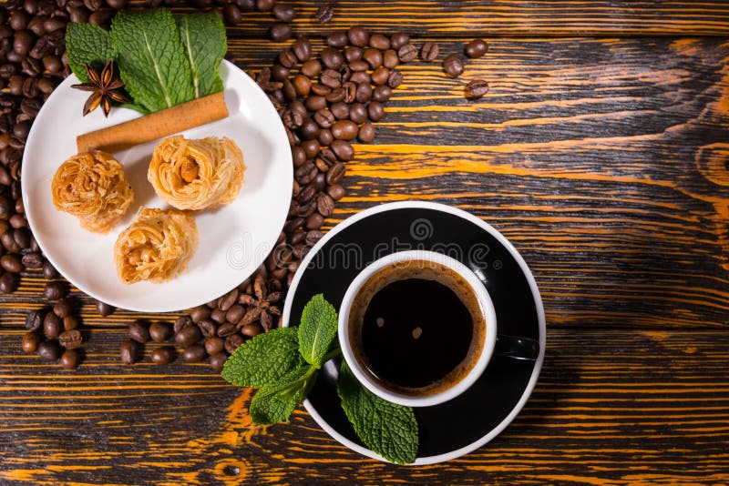 Black Coffee with Gourmet Pastries on Wood Table royalty free stock photos Black Coffee with Gourmet Pastries on Wood Table royalty free stock photos